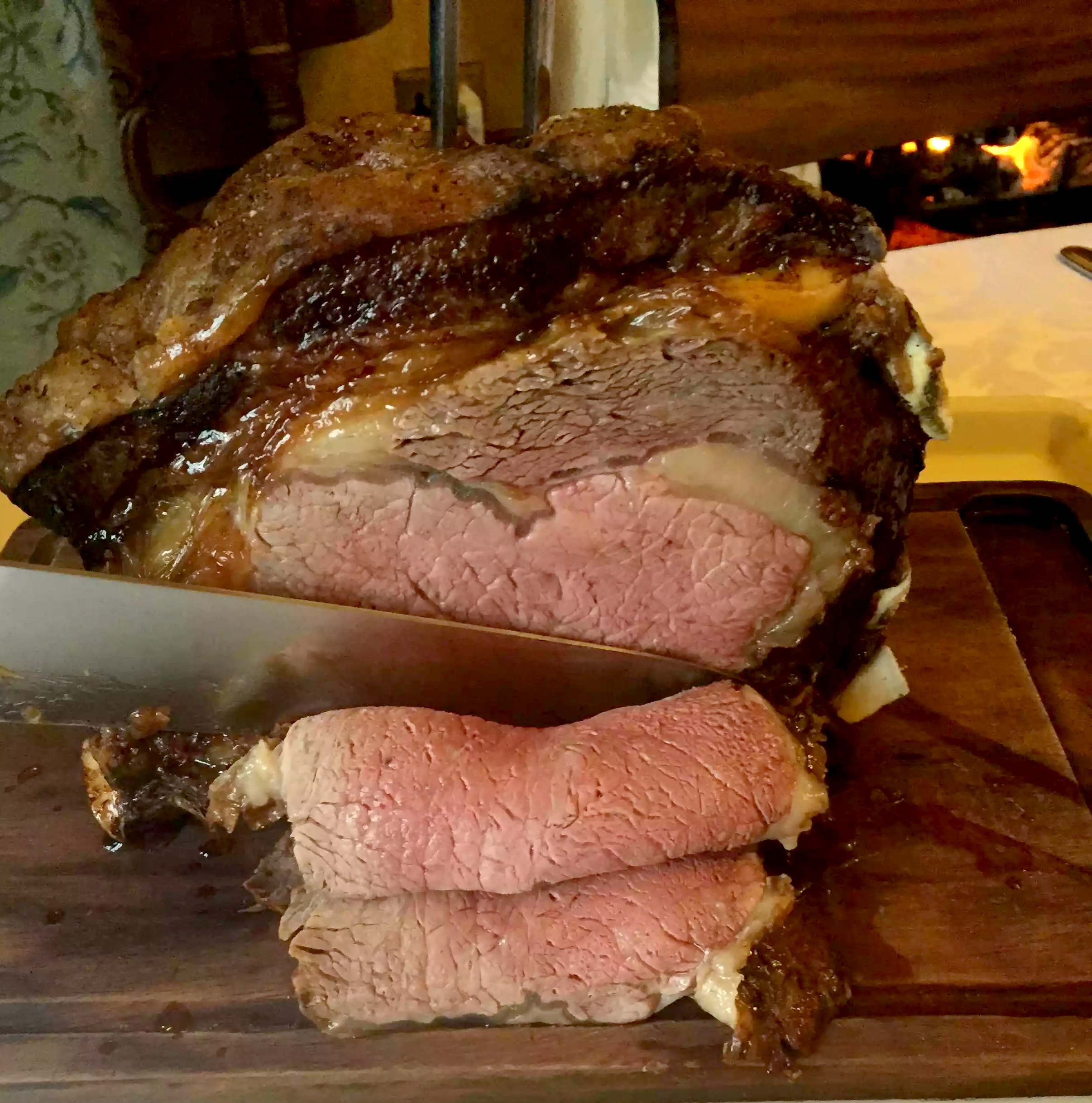 Chef Carving Perfectly Cooked Prime Rib Roast Beef Stock Photo