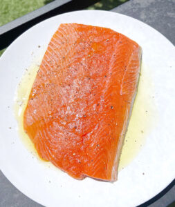 Raw Salmon Seasoned with salt pepper and olive oil