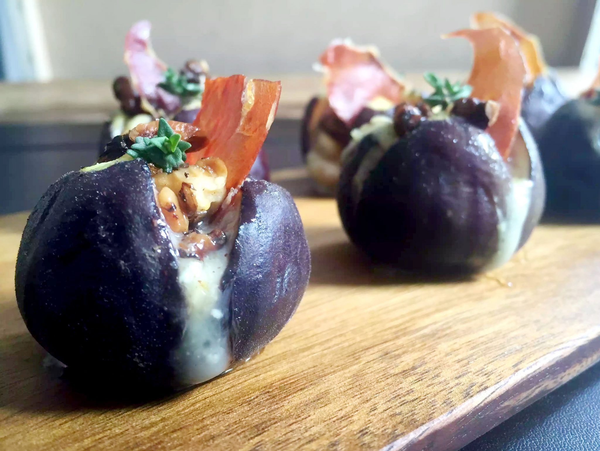 Grilled Figs with Goats Cheese, Crispy Prosciutto, Pecans & Honey