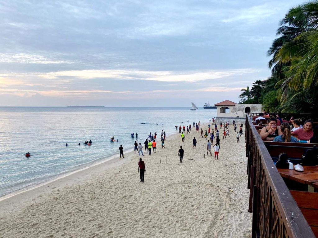 walking along the beach at sunset in Stone Town