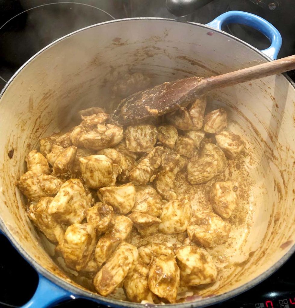 cooking the chicken with the masala spices from Zanzibar