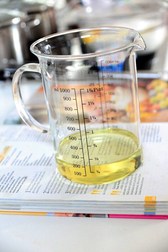 measuring jug with oil