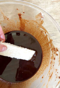 Dipping the Chocolate Covered Coconut Bars
