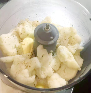 Steamed cauliflower and butter in food processor