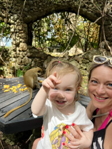 Mum & Daughter feeding monkeys in Barbados