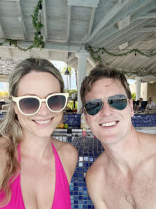 A couple smiling at Pier One in Barbados