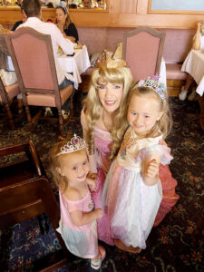 Girls meeting Aurora at Auberge de cendrillon Breakfast