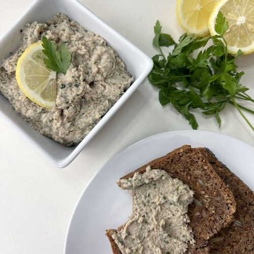 Dairy-Free Smoked Mackerel Paté in bowl with some spread on toast with bite taken out