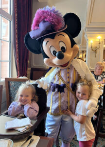 Girls meeting Mickey at the Royal Banquet at disneyland Paris