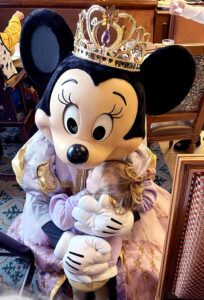 Girls meeting Minnie at the Royal Banquet at disneyland Paris