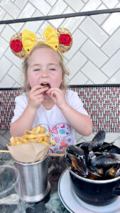 Nellie Eating Mussels at Disneyland