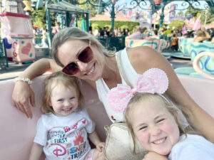 Mama and girls on the Teacups at Disneyland Paris